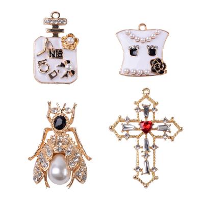 China New alloy handbags accessories perfume bottle, alloy jewelry cross pendant diy accessories for sale