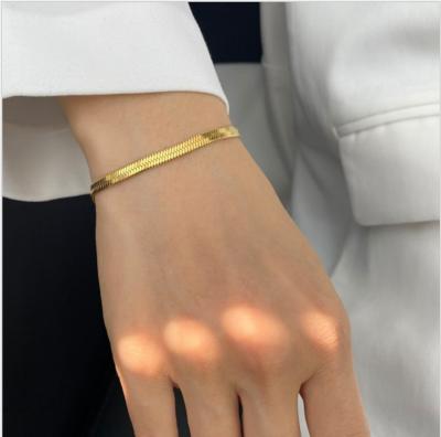 China TRENDY Minimalist 18k Gold Plated Stainless Steel Flat Fishbone Snake Chain Bracelet For Women for sale