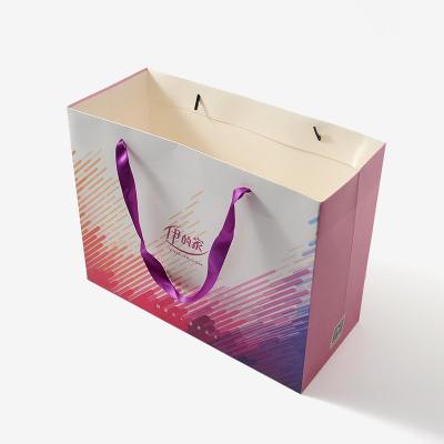 China Handmade Competitive Price Brand Luxury Boutique Shopping White Logo Gift Elegant Customized Shopping Paper Bags With Ribbon Handles for sale