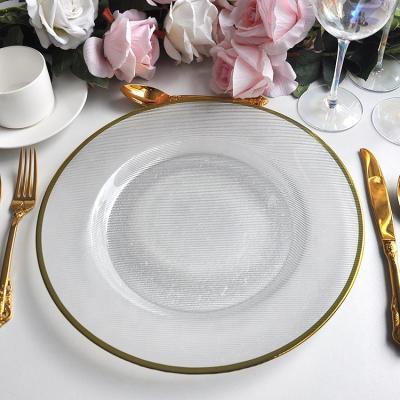 China Stocked 2022 Custom New Style Gold Rim Radius Glass Charger Plates Wedding Party Decoration Supplies for sale