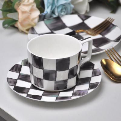 China Stock Products Bone China Tea Cup Grid Coffee Cup Ceramic Black And White Cups And Saucers for sale