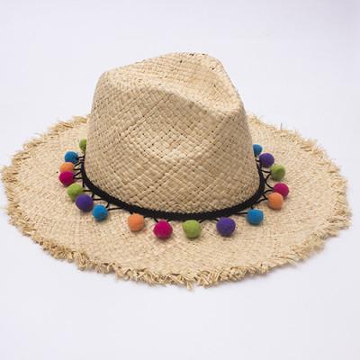 China Custom striped summer sombreros mujer sun protective recyclable raffia bucket pom pom colorful straw hat beach hat with fringed tips for sale