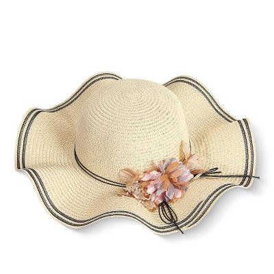 China 2021 Color Wave Striped Curve Pure Brim Big Big Brim Beach Straw Hats For Women Girls With Flower for sale