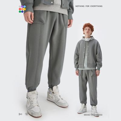 China Custom Solid Logo 350gsm Anti-wrinkle Sportswear Jogging Pants Stacked Sport Tracksuit for sale