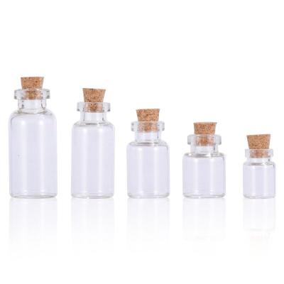 China Personal care 0.5ml 1ml 2ml 3ml 5ml corked bottles empty small tiny clear glass bottles with cork for sale