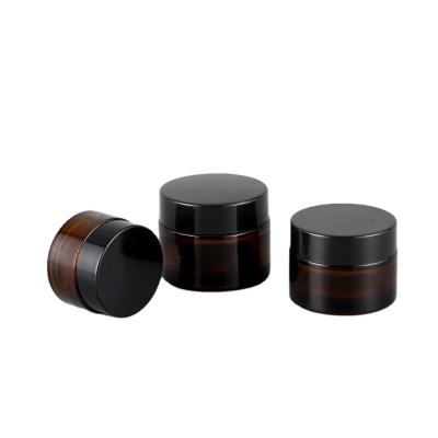 China Cosmetic 30g 50g Frosted Matte Amber Black Glass Cream Jar With Gold Screw Lid for sale