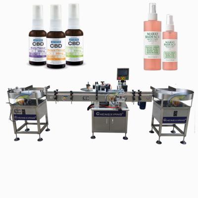 China Food spray automatic bottle labeling machine 30ml 50ml 180ml, round bottle labeling machine en venta