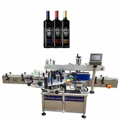 China Automatic Beverage Dropper Flat Round Bottle Sticker Double Side Adhesive Labeling Machine Price en venta