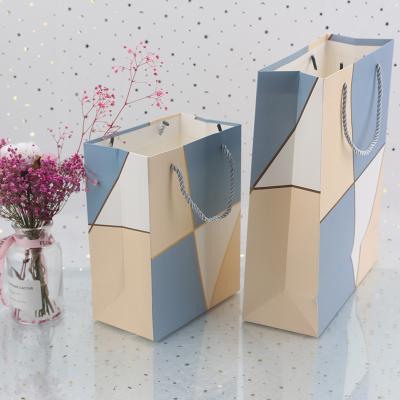 China Recycled Materials Customized Handle Bag Jewelry Perfume Gift Bag Cupcake Shoe Packaging Bag Cheap Wholesale Packaging Paper With Bow Knot for sale