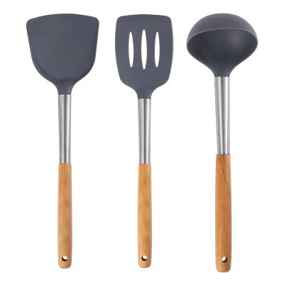 China Sustainable Silicone Utensils Kitchen Set Silicon Tools Cooking Pouches Shovel Kitchenware With Wooden Handle for sale