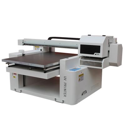 China 2023 Hotels Custom Portable High Quality Small Format 6090 UV Printer with 3 pcs TX800 heads for mylar bags bag and sacket for sale