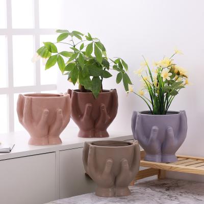 China Wholesale High Quality Minimalist Ceramic Planter Hold Up Hands Shape Decorative Custom Ceramic Planter Plant Pots For Home Decor for sale