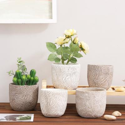 China Wholesale Minimalist Cement Planter With Embossed Flower Pots And Planters With Leaf Pattern Design Garden Plant Pots for sale