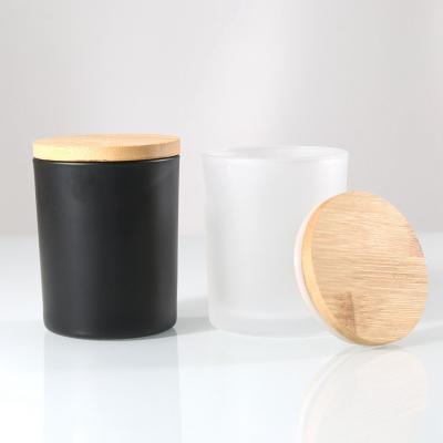 China Gift & Craft Factory Price 10OZ Black Frosted Wide Mouth Container Glass Candle Jars With Wooden Lids Bulk for sale