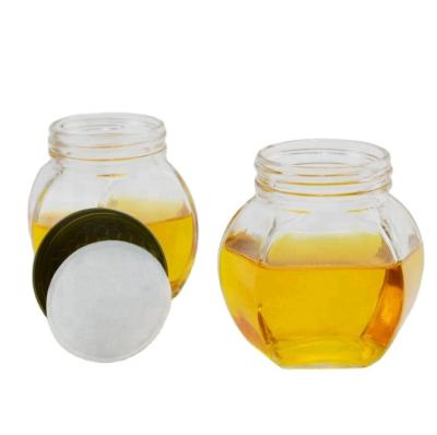 China Honey Hexagon Honey Jar Food Grade Glass Storage Jar 180ml 380ml Glass Honey Jar With Plastic Lid for sale