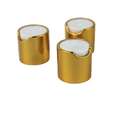 China Non Spill 24mm 28mm Metal Anodized Top Press Disc Cap Gold And Silver Color With Glossy Or Matte Treatment For Cosmetics Packaging for sale