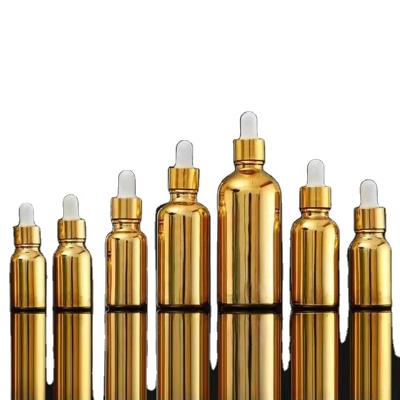 China UV Essential Oil Finishing Gold And Silver Dropper Glass Bottles Essential Oil Or Perfume Dropper Bottles for sale