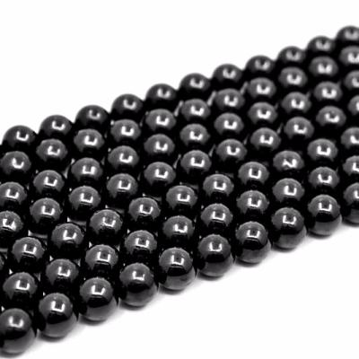 China Grommet Spacer Stone Beads Charm Gemstone Black Natural Smooth Jet Stone Loose Beads For Jewelry Wholesale Making for sale