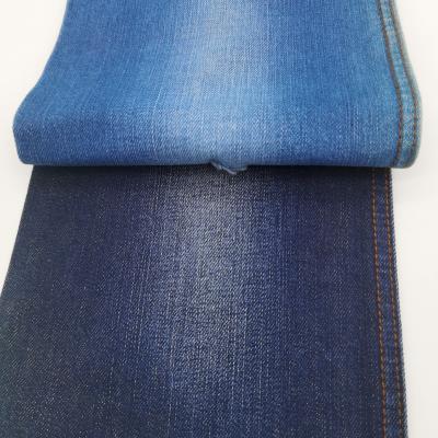 China Stock Yarn Breathable Indigo Dyed Elastic Denim Fabric Reduce The Price Of Jeans for sale