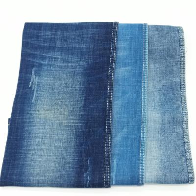 China Large Breathable Spandex Twill Weave Medium Weight Denim Fabric Stock For Women Jeans for sale