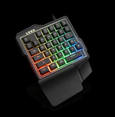 China Popular Design Convenient Hand Plug & Play One Using RGB Colorful Light Mini Mechanical Cheap Gaming Keyboard for sale