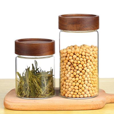 China Freshness Preservation Customized 800ml Mouthblown Leakproof Heat Resistant Glass Food Storage Jar With Wooden Lid for sale