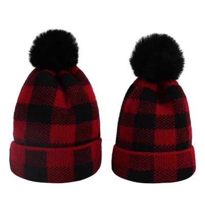 China New JOINT winter wool ball parent-child knitted hat Christmas buffalo lattice warm hat for sale