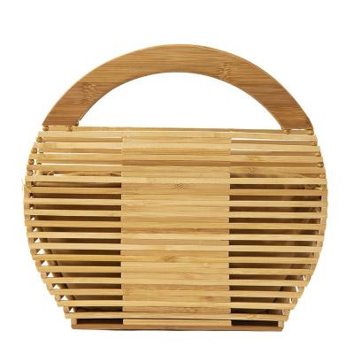 China PORTABLE natural bamboo straw woven round handbag clutch bag for women hollow basket bag round bamboo handbag for hollow women for sale