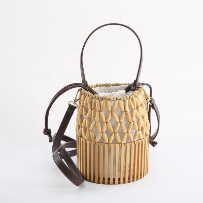 China Eco friendly bamboo beaded bags with fabric lining and leather belt for sale