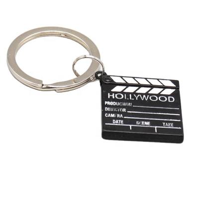 China Mini Film Director Movie Cut Metal Action Scene Funny Zinc Alloy Clamshell Panel Shaped Key Ring Holder Keychain for sale