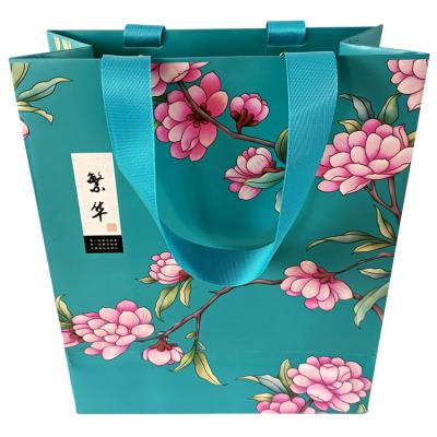 China Durable Custom Clothing Paper Bags Packaging Paper Bags In Various Colors Are Printed With Their Own Shopping Logos for sale