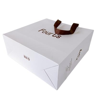 China Recyclable Wholesale Luxury White Clothes Packing Printed Custom Apparel Shopping Gift Paper Bags For Apparel Custom Logo for sale