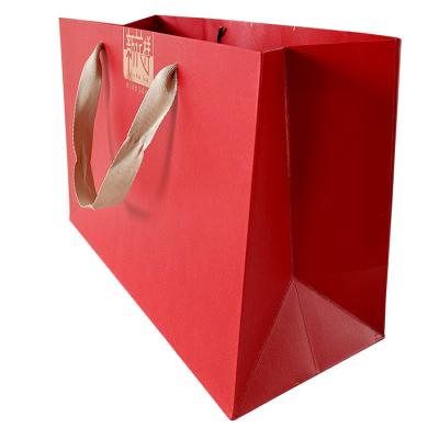 China Durable Popular New Design Waterproof Full Color Custom Printed Cosmetics Paper Bag for sale