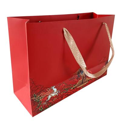 China Durable Customization Luxury Pink Cardboard Paper Bag With Ribbon Handle for sale