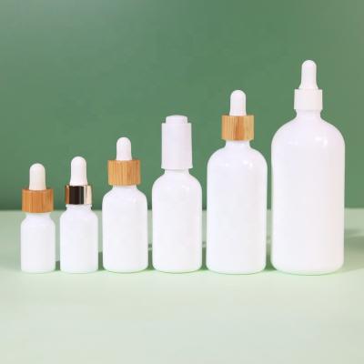 China 10ml 15ml 30ml 50ml 100ml 200ml custom white china bottle cosmetic essential oil dropper bottle for sale