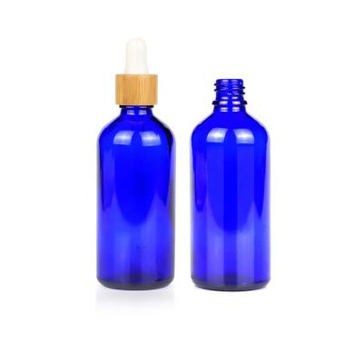 China 100ml Cosmetic High Quality Glass Dropper Bottles Blue Essential Oil Bottle With Dropper Bamboo for sale