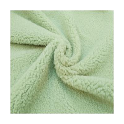 China Wholesale cheap popular super soft polyester green plush fur fabric trade fire retardant for sale