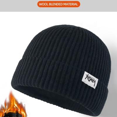 China New JOINT Heat and thickening elastic patch knitted plain 100% acrylic high quality winter beanies accept logo customized for sale