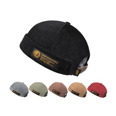 China 2021 Character Cotton Custom 6 Panel Brimless Custom Label Embroidered Label Skull Cap 100% Hot Selling Hat for sale