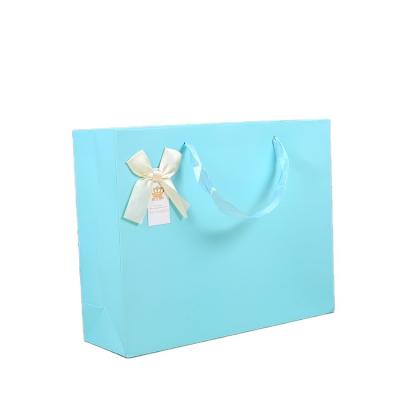 China Custom Paper Recyclable Paper Bag Packaging Bags With Your Own Logo Gift Clothing Paper Bag Wholesale for sale