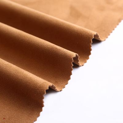 China Esse Anti-static Hot Sale Micro Cheap Polyester Yellow Strong Stretch Suede Fabric For Women Clothing Use for sale