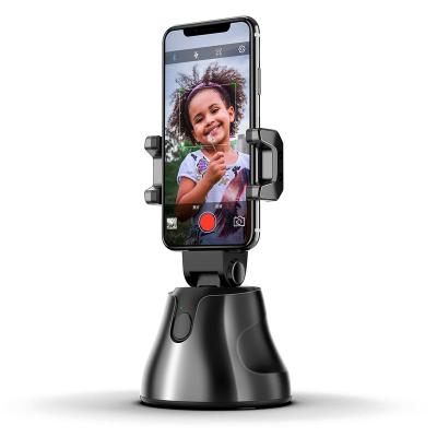 China 360 Degree Rotating Full Rotation Auto Selfie Face Smart Object Tracking Cell Phone Holder for sale