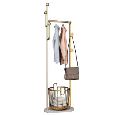 China Eco-friendly Type Ins Clothing Gold Free Sample Metal Floor Thin Luxury Creative Layer Racks With Storage Basket for sale