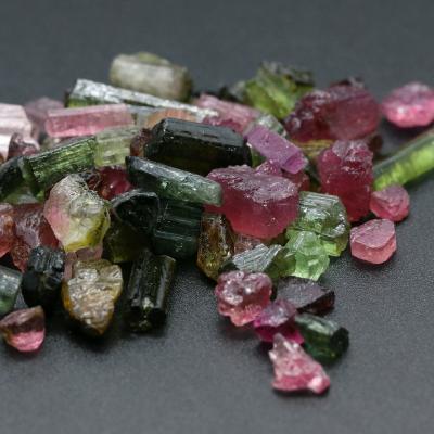 China No natural rough uncut color tourmaline stone price for pink tourmaline gemstone ring black bracelet pendant for sale