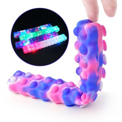 China Relieve Stress Anti-Anxiety Squidopop Stir Toys Suction Cup Silicone Sheet Tapping Squid Noise Toy With Led Light for sale