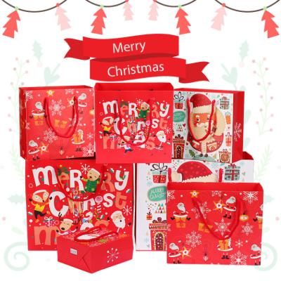 China DF Recyclable Custom Size Laminated Colorful Fancy Red Cardboard Merry Christmas Eve Holiday Cardboard Wrapping Paper Handle Gift Paper Bag for sale