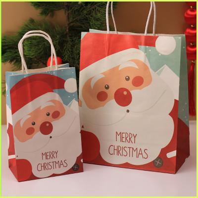 China Recyclable DF Merry Wholesale Cheap Custom Logo Colorful Christmas Eve Cardboard With Twist Handle String Gift Packing Kraft Paper Handbag for sale