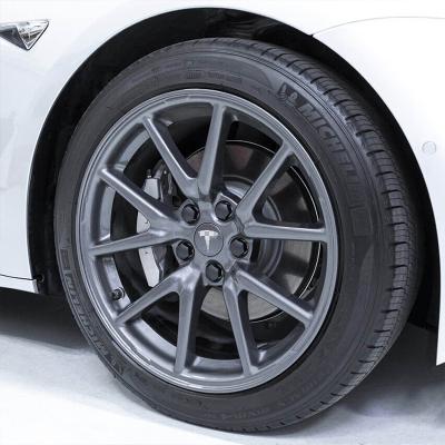 China Luxury 4Pcs Stainless Steel Car Wheel Center Covers Hub Cover With Logo Badge For Tesla Model 3 S X for sale