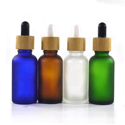 中国 5ml 10ml 30ml 50ml 120mlの精油のためのタケつばが付いているガラス点滴器のびん 販売のため