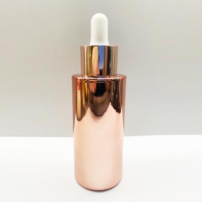 Chine ODM Rose Gold Electroplating Glass Dropper d'OEM met la forme en bouteille ronde à vendre